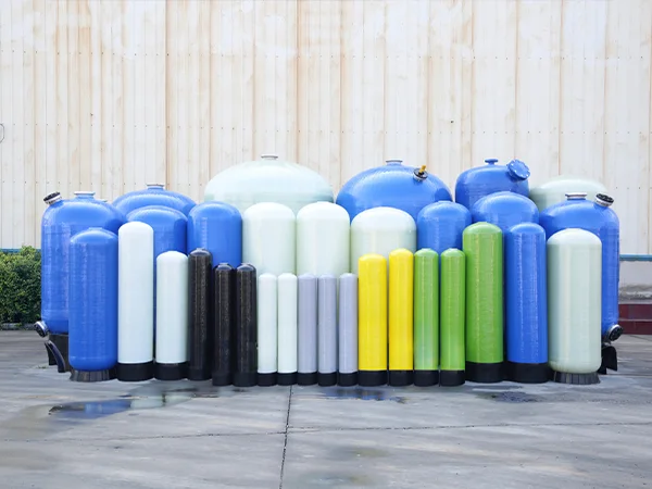 Several different colors and volume FRP tanks in the yard.